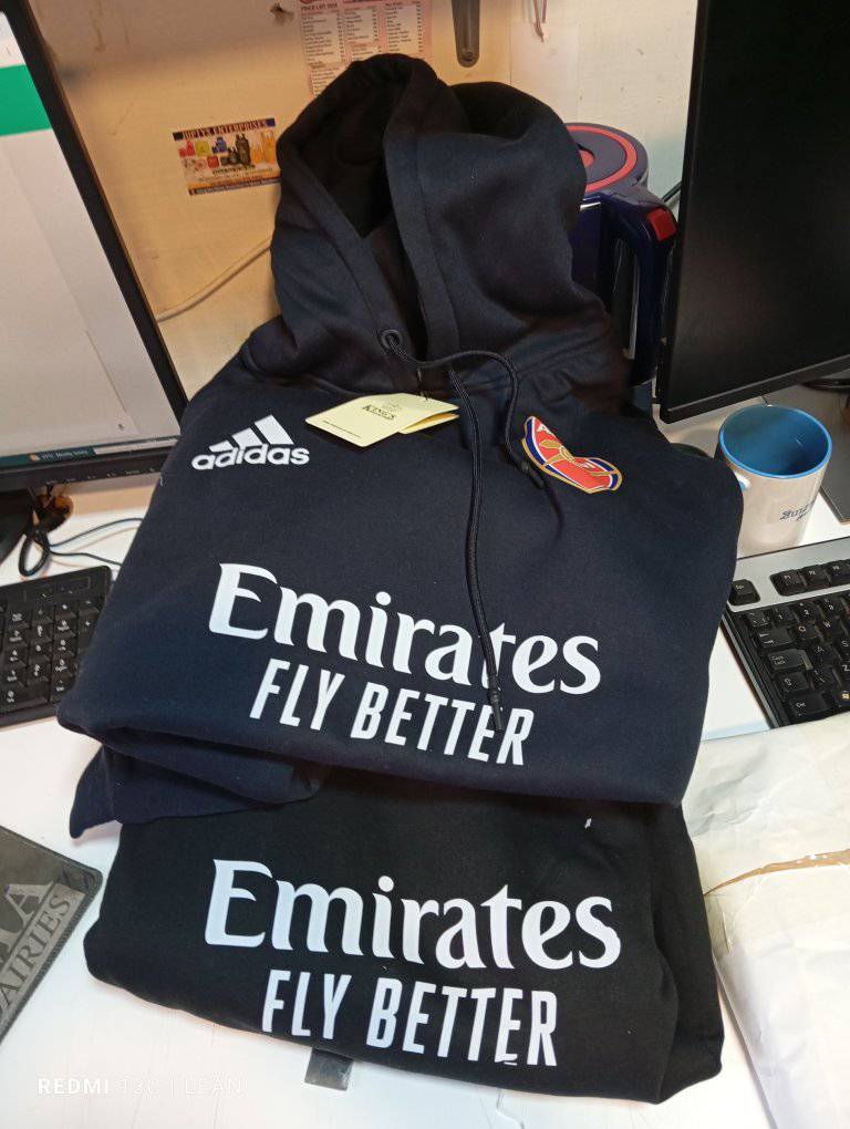 Arsenal branded sportswear with sponsor printing